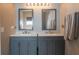 Modern bathroom featuring dual sinks, framed mirrors, and contemporary fixtures at 14461 Brook Meadow Dr, McCordsville, IN 46055