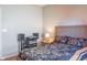 This bedroom offers a comfortable bed, nightstand, and an audiophile's setup at 14461 Brook Meadow Dr, McCordsville, IN 46055