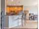 Modern kitchen with stainless steel appliances, granite countertops, and a breakfast bar at 14461 Brook Meadow Dr, McCordsville, IN 46055