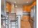 Well-lit kitchen features stainless steel appliances, light wood cabinets, and bar seating at the counter at 14461 Brook Meadow Dr, McCordsville, IN 46055