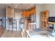 Kitchen view from the dining room, featuring stainless steel appliances and a breakfast bar at 14461 Brook Meadow Dr, McCordsville, IN 46055