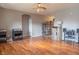 Open living room with hardwood floors and an archway leading to another room at 14461 Brook Meadow Dr, McCordsville, IN 46055