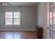 Bright living room boasts hardwood floors and a window, complemented by classic trim at 14461 Brook Meadow Dr, McCordsville, IN 46055