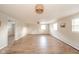 Finished basement with wood floors and views of the windows and ceiling lights at 1718 Charles St, Anderson, IN 46013