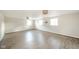 Finished basement with wood floors, neutral walls, and natural light from the windows at 1718 Charles St, Anderson, IN 46013