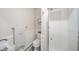 Elegant bathroom featuring a glass-enclosed shower, toilet, and decorative wainscoting at 1718 Charles St, Anderson, IN 46013