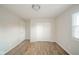 Spacious bedroom features wood-look flooring, closet, and a bright window at 1718 Charles St, Anderson, IN 46013
