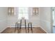 Bright dinette with pub table and updated lighting at 1718 Charles St, Anderson, IN 46013
