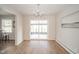 Dining room with wood floors and sliding doors leading to a screened-in porch at 1718 Charles St, Anderson, IN 46013