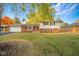 Charming single-Gathering home with brick and vinyl siding and a well-manicured front lawn at 1718 Charles St, Anderson, IN 46013