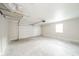 Spacious two car garage with a white garage door at 1718 Charles St, Anderson, IN 46013