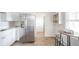 Bright eat-in kitchen with stainless steel refrigerator and adjacent dinette at 1718 Charles St, Anderson, IN 46013