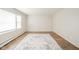 Bright living room with wood floors, large windows, and neutral walls at 1718 Charles St, Anderson, IN 46013