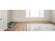 Sunlit living room featuring wood floors and a large window at 1718 Charles St, Anderson, IN 46013