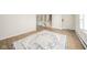 Spacious living room with hardwood floors, a neutral color palette, and a staircase at 1718 Charles St, Anderson, IN 46013