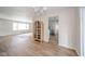Open-concept living room with wood flooring, ample light, and views of the kitchen at 1718 Charles St, Anderson, IN 46013