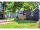 Exterior view of the home showing the new wooden deck and partially shaded backyard at 1933 Koehne St, Indianapolis, IN 46202