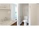 Bathroom featuring a modern vanity with a sleek sink and neutral walls at 1933 Koehne St, Indianapolis, IN 46202