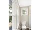 Bathroom featuring a toilet and windows at 1933 Koehne St, Indianapolis, IN 46202