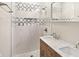 Updated bathroom featuring a stylish walk-in shower with a modern vanity and dual sinks at 1933 Koehne St, Indianapolis, IN 46202