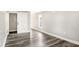 Large bedroom with vinyl flooring, neutral colors, window, and barn door closet at 1933 Koehne St, Indianapolis, IN 46202