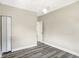 This room has a closet, vinyl floors, modern lighting, and a fresh, neutral color scheme at 1933 Koehne St, Indianapolis, IN 46202