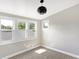Bright bedroom with large windows offering plentiful sunlight with neutral walls and carpeting at 1933 Koehne St, Indianapolis, IN 46202