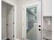 View of the deck and backyard through the white-framed glass door, complementing the neutral color scheme at 1933 Koehne St, Indianapolis, IN 46202