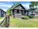 Eye-level view of the home featuring landscaping and a stone exterior at 1933 Koehne St, Indianapolis, IN 46202