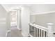 Upstairs hallway featuring white trim and neutral-colored walls at 1933 Koehne St, Indianapolis, IN 46202