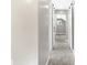 Bright hallway features neutral colors and barn doors leading to storage or other rooms at 1933 Koehne St, Indianapolis, IN 46202