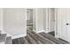 Bright hallway features new gray vinyl flooring and white trim at 1933 Koehne St, Indianapolis, IN 46202