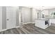 Open-concept kitchen with an island, stainless steel appliances, and modern lighting at 1933 Koehne St, Indianapolis, IN 46202