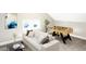 Bright living room with white sofa, foosball table, and contemporary decor at 1933 Koehne St, Indianapolis, IN 46202