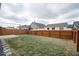 Large fenced backyard with a patio area perfect for entertaining guests at 2452 Bristol Dr, Franklin, IN 46131