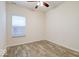 Cozy room with wood-look floors, a ceiling fan, and a bright window at 2452 Bristol Dr, Franklin, IN 46131