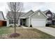 Inviting single-Gathering home featuring a two-car garage and well-kept landscaping at 2452 Bristol Dr, Franklin, IN 46131