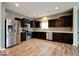 Modern kitchen featuring stainless steel appliances, dark cabinets, and plenty of countertop space at 2452 Bristol Dr, Franklin, IN 46131
