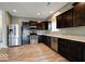 Well-equipped kitchen with stainless steel appliances, dark cabinets, and ample counter space for cooking at 2452 Bristol Dr, Franklin, IN 46131