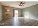 Bright living room featuring a ceiling fan, sliding glass doors, and wood-look floors for a modern feel at 2452 Bristol Dr, Franklin, IN 46131