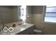 Bathroom featuring a double vanity sink with white countertop and updated fixtures at 3121 W 13Th St, Anderson, IN 46011