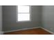 A well lit bedroom with a single window and wood floors at 3121 W 13Th St, Anderson, IN 46011