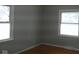 A well lit bedroom with two windows and wood floors at 3121 W 13Th St, Anderson, IN 46011