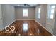 Bright living room with hardwood floors, neutral walls, and a minimalist design at 3121 W 13Th St, Anderson, IN 46011