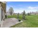 Expansive backyard with lush green lawn, mature trees and community views at 4038 Oak Trail Dr, Indianapolis, IN 46237