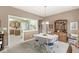 Bright dining room features a view into the kitchen and an elegant hutch at 4038 Oak Trail Dr, Indianapolis, IN 46237