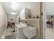 Bright laundry room featuring a utility sink, washer, dryer, cabinetry and workspace at 4038 Oak Trail Dr, Indianapolis, IN 46237