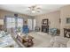 Cozy living room features a fireplace, ceiling fan, comfortable seating, and neutral color palette at 4038 Oak Trail Dr, Indianapolis, IN 46237
