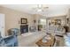 Spacious living room with fireplace open to the dining area, and neutral paint at 4038 Oak Trail Dr, Indianapolis, IN 46237
