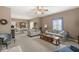 Open-concept living room flows into the dining area, featuring comfortable seating and a neutral color scheme at 4038 Oak Trail Dr, Indianapolis, IN 46237